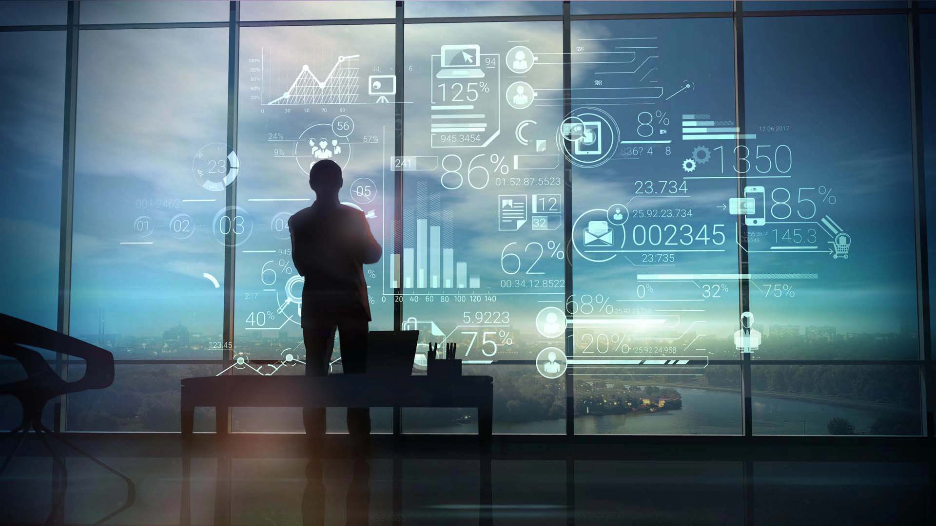Man standing in front of wall of data