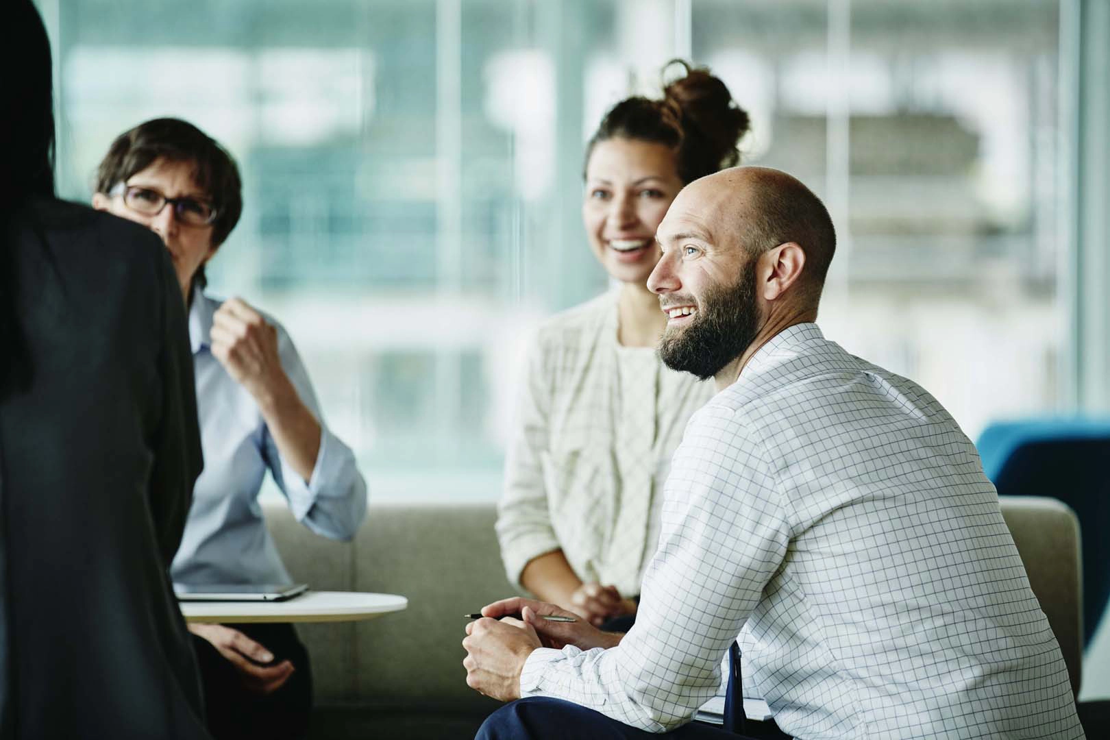 Office workers sitting and talking
