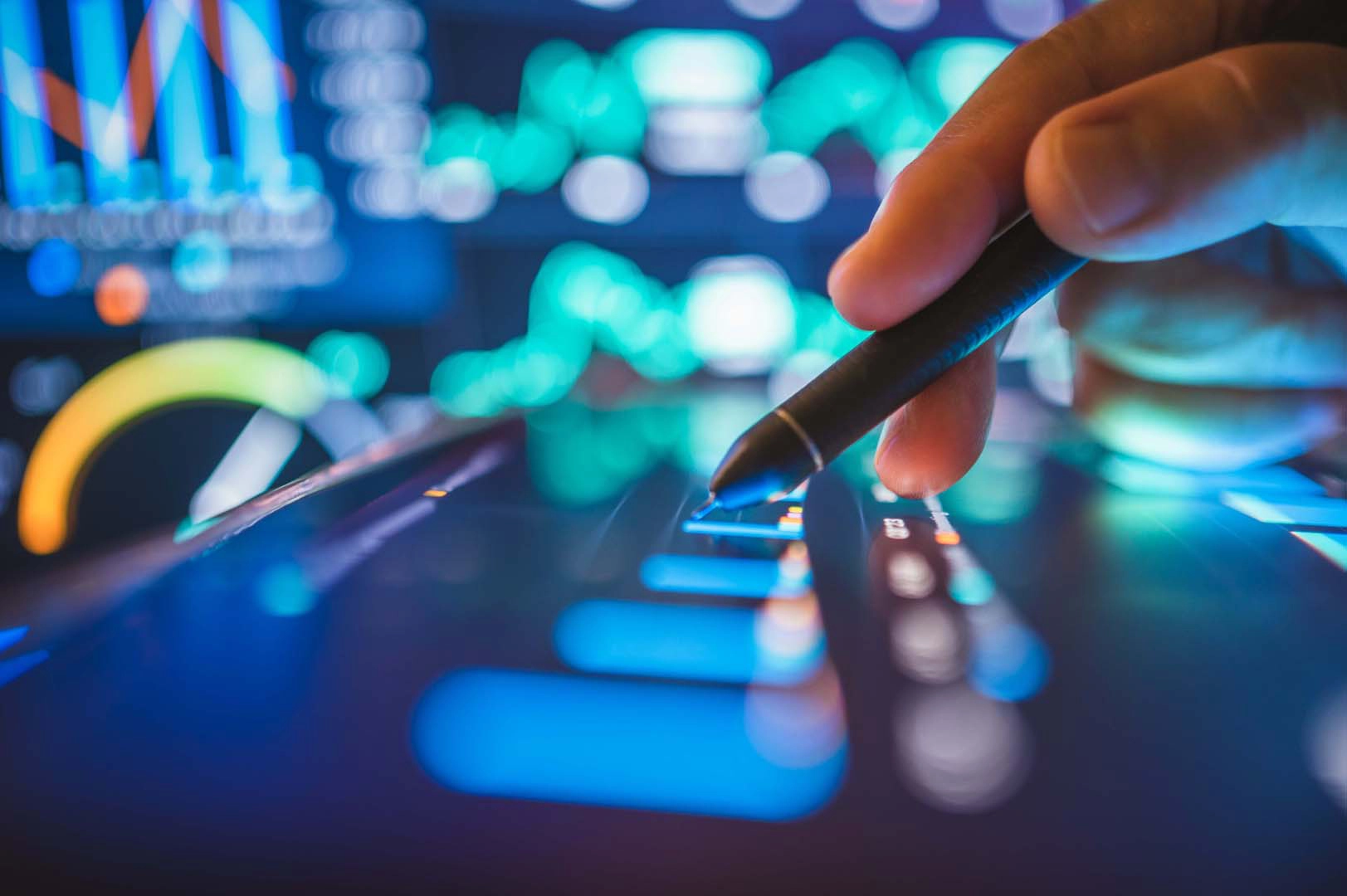 Pen on screen with graphs