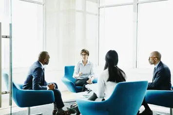 four people talking