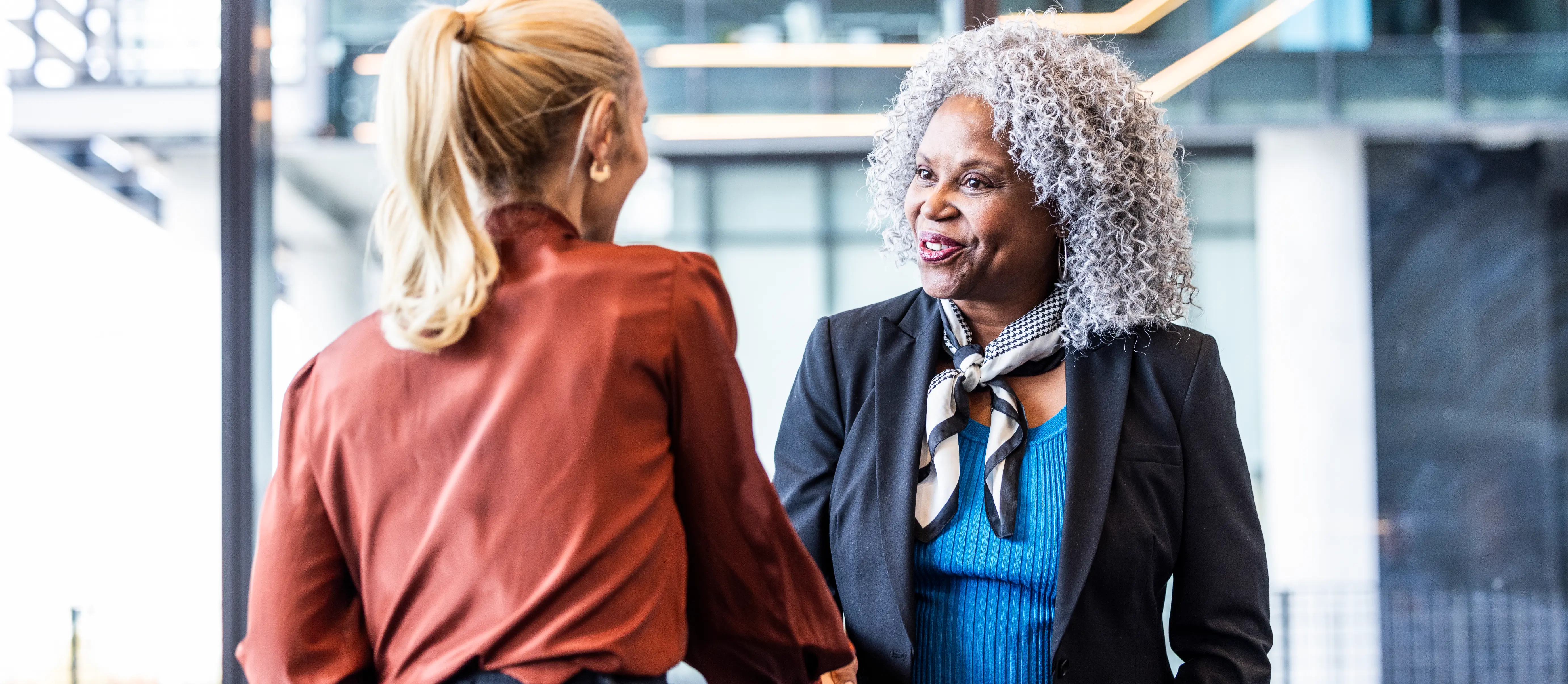 Office workers shaking hands