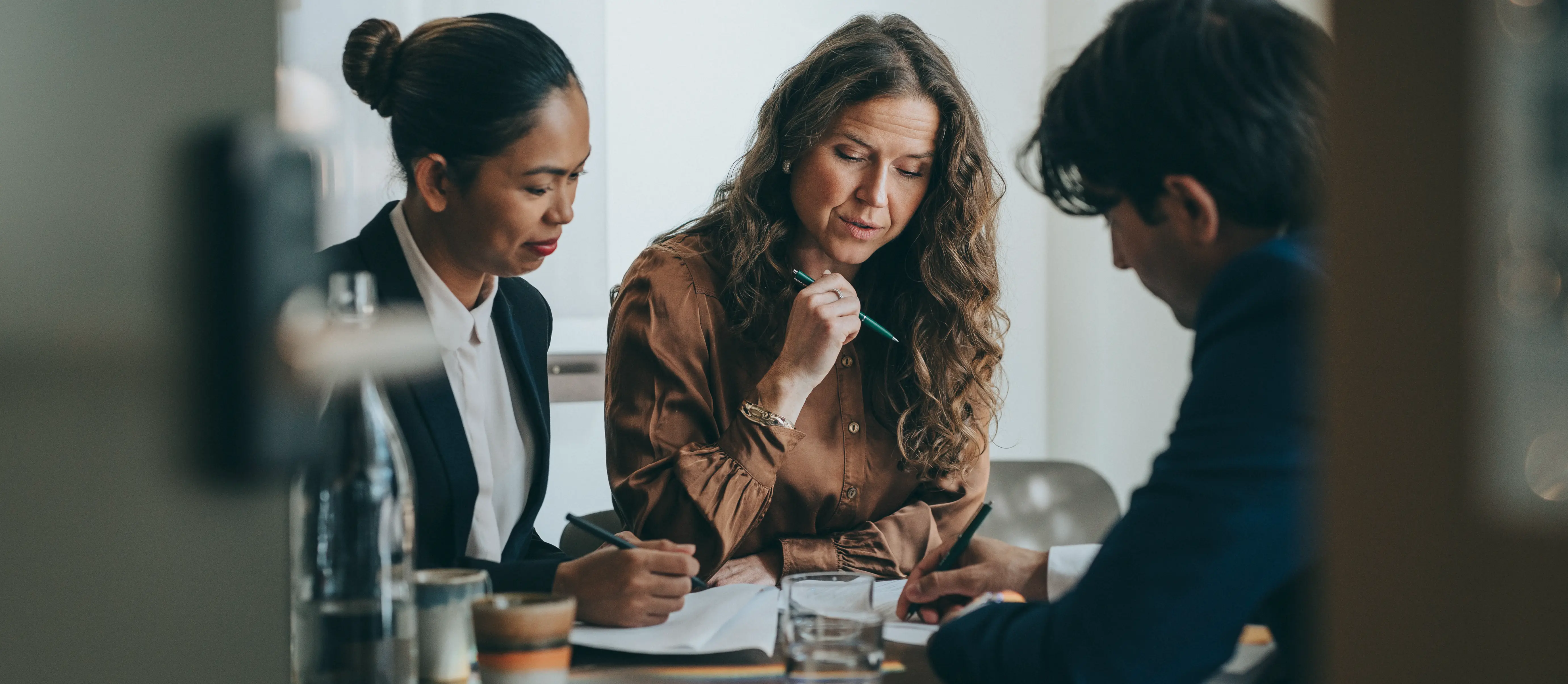 Office workers studying documents