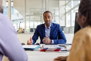 Meeting between three people