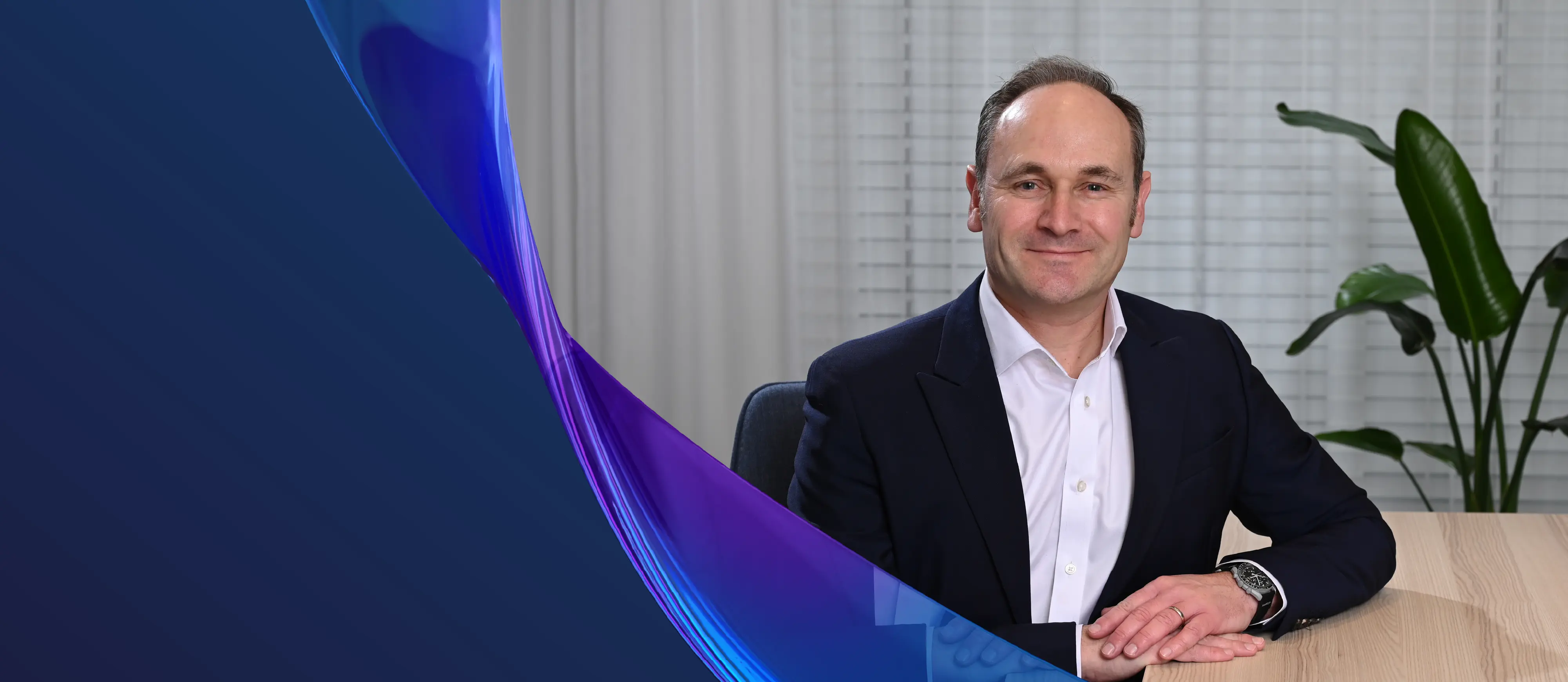 Chris Osborne at desk