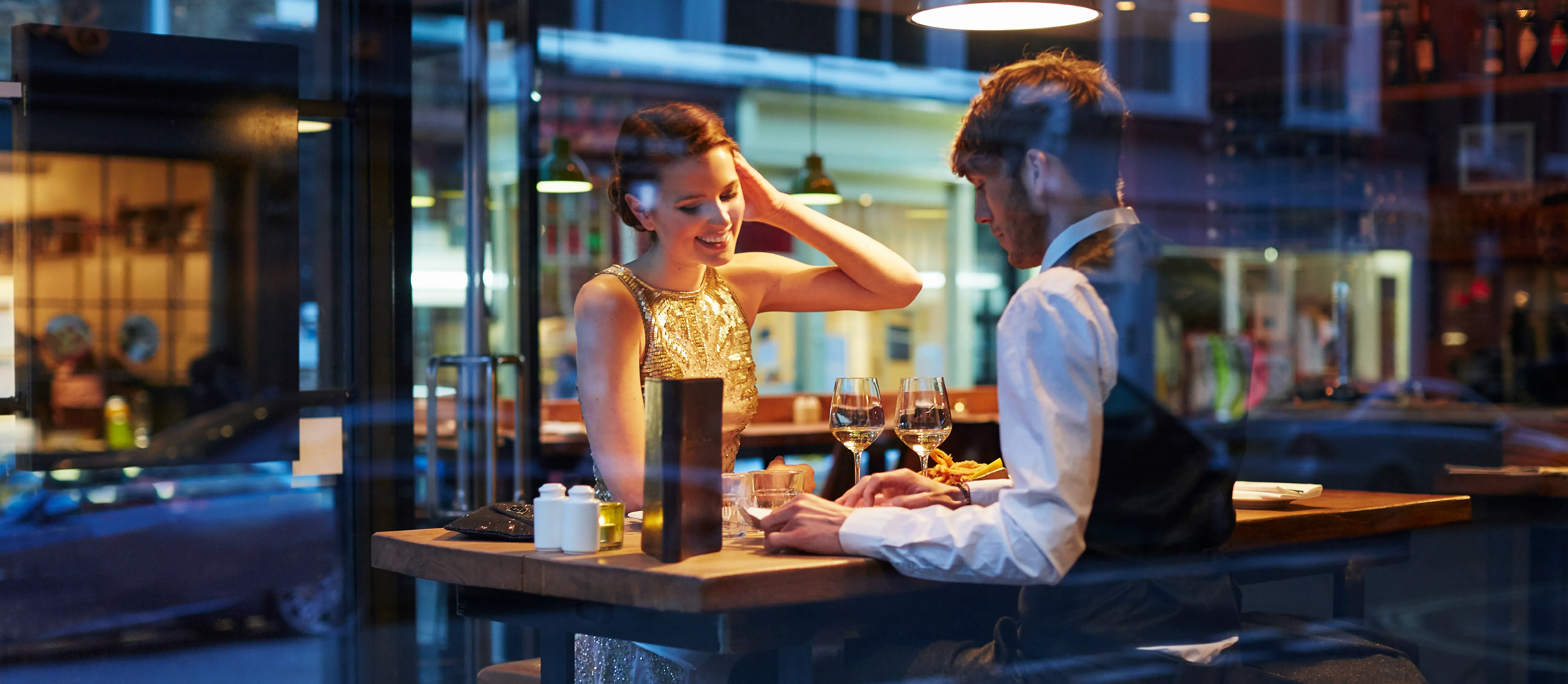 A couple dine at a restaurant