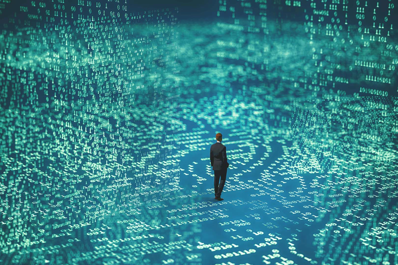 A man stands on a floor of digital numbers
