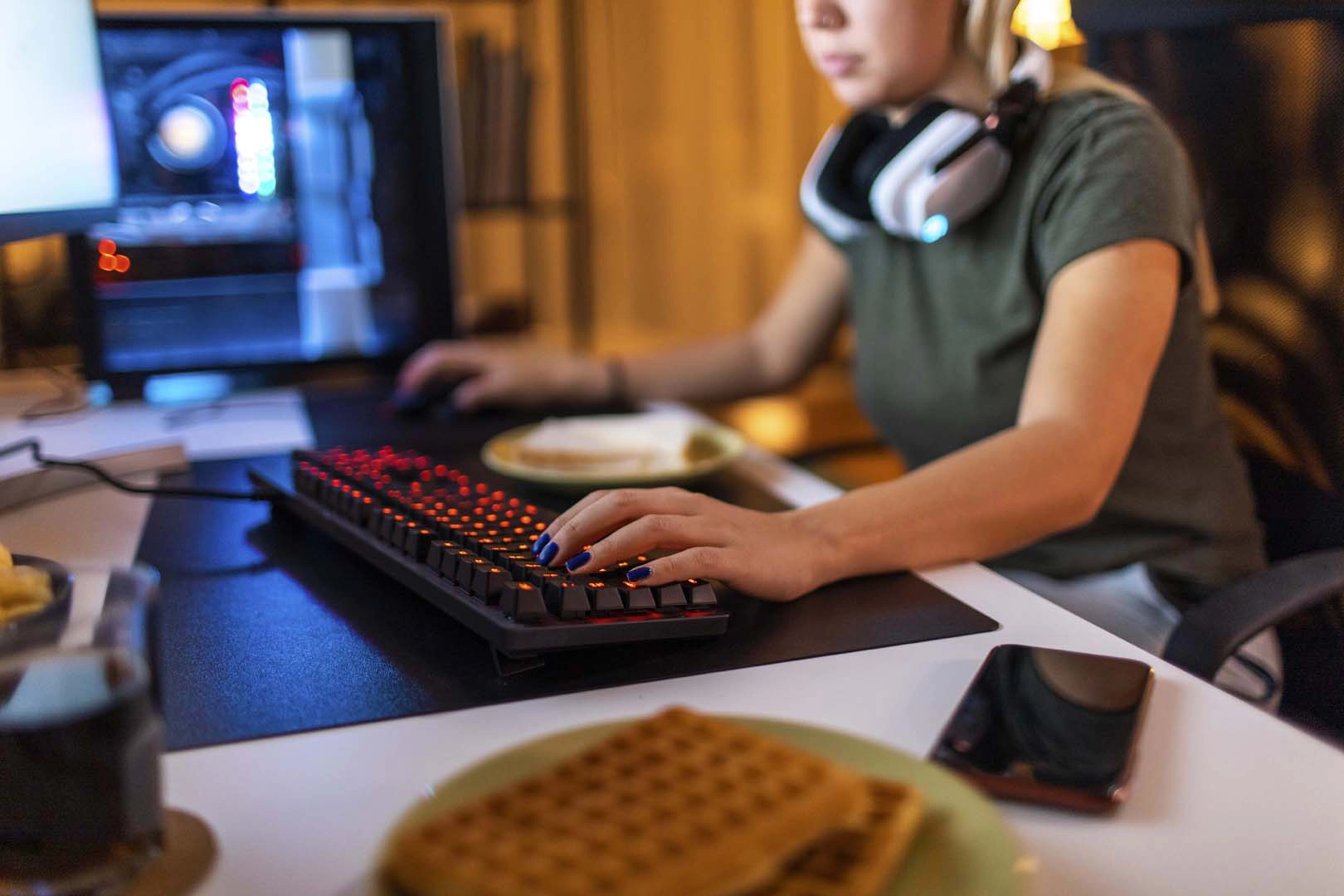 Young woman sits at computer