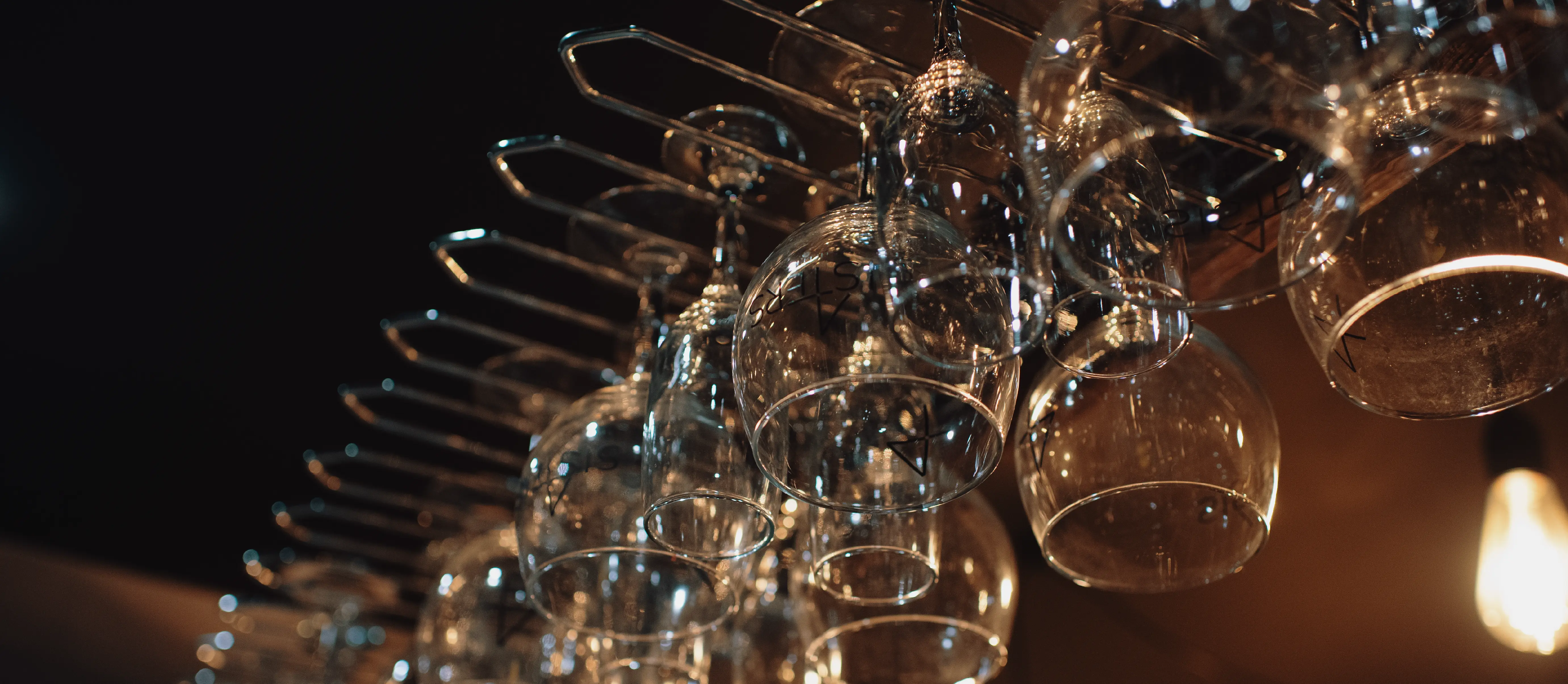 Glasses hanging in a bar